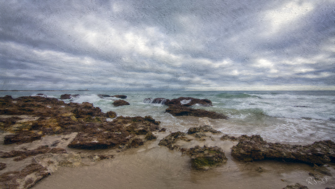 Stormy ocean waves meeting rugged rocks beneath a textured sky, symbolizing the emotional meeting point of joy and grief.